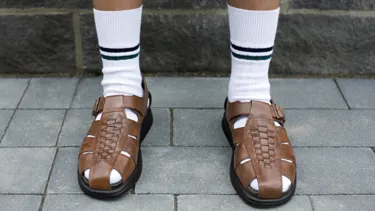 Man with socks in sandals