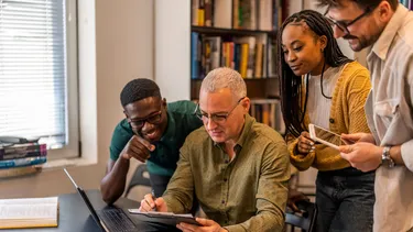 Multiethnic group of four adults learning together.