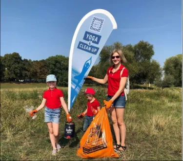 Marina Shalginskikh with her children collecting rubbish