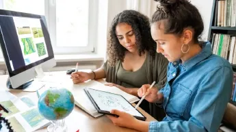 Two women work on climate protection concepts on the computer