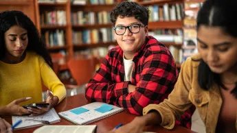 Young man in library