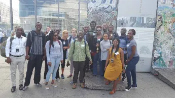 In front of a piece of the Berlin Wall: Participants of the German-South African Research Training Group Wits-TUB Urban Lab