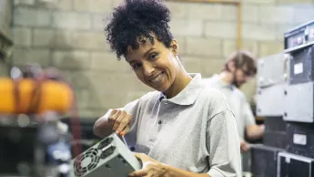 Woman repairs computer